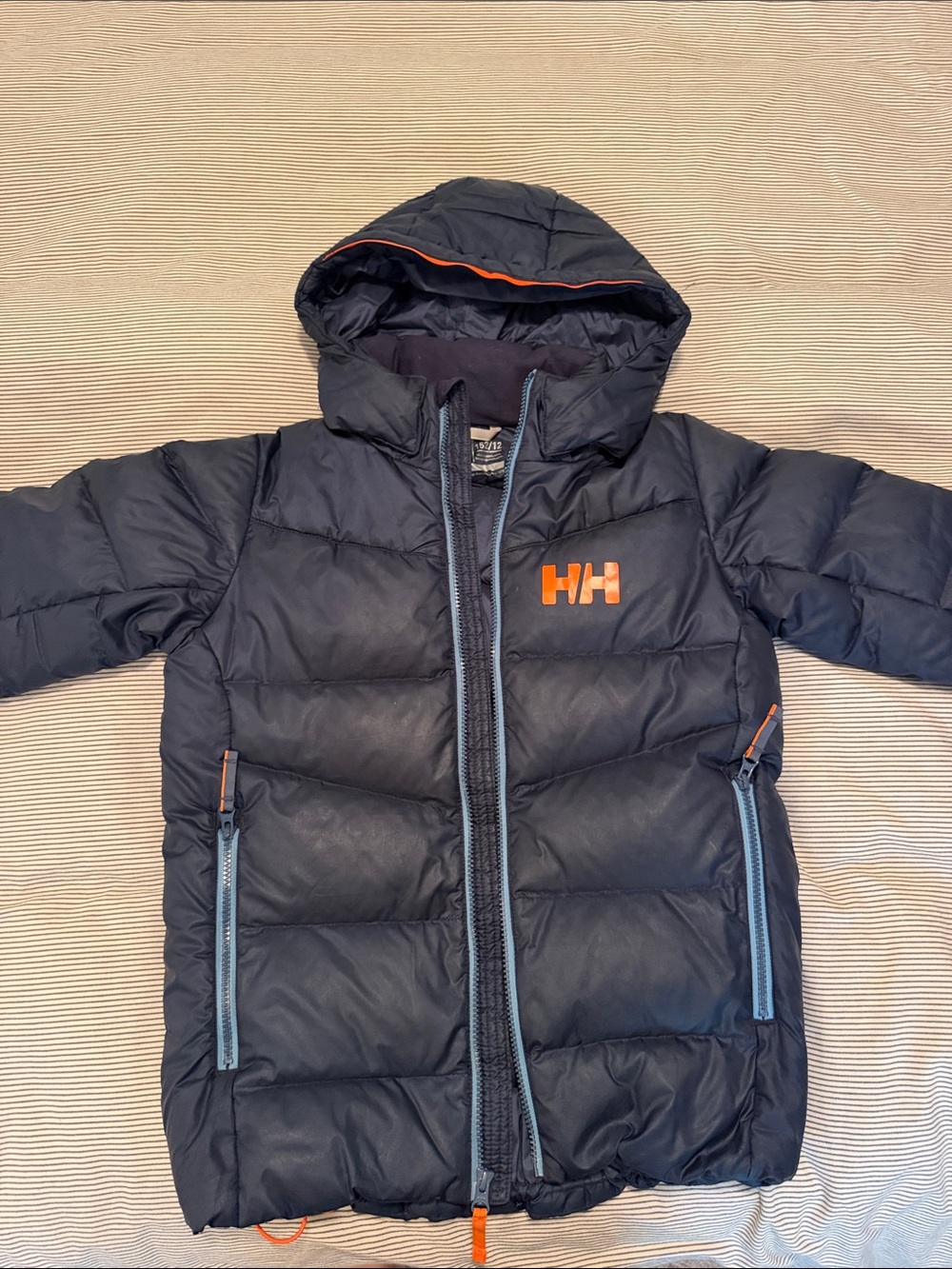 Helly Hansen Navy Puffer Jacket with Orange HH Logo and Light Blue Accents